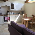 kitchen and seating area in potting shed