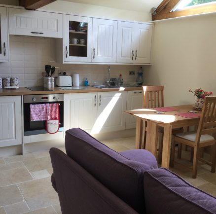 kitchen and seating area in potting shed