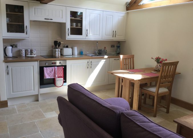 kitchen and seating area in potting shed