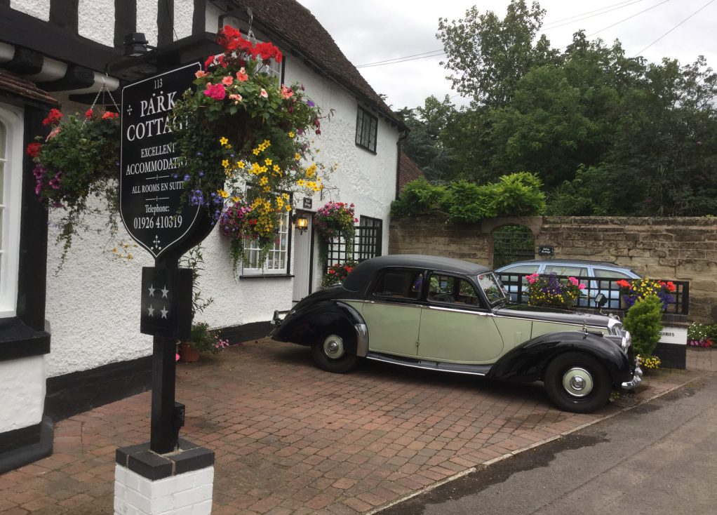 A vintage car Parked outside the cottage