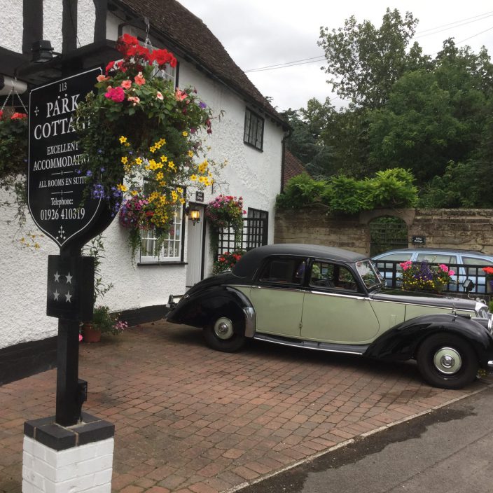 A vintage car Parked outside the cottage