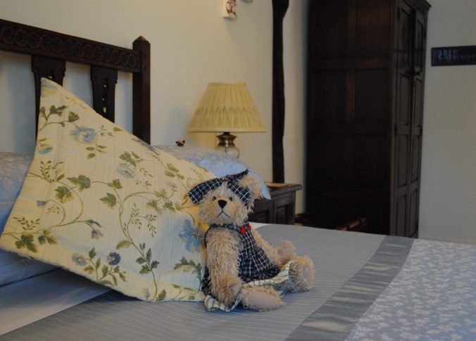 teddy bear on double bed in catherine room